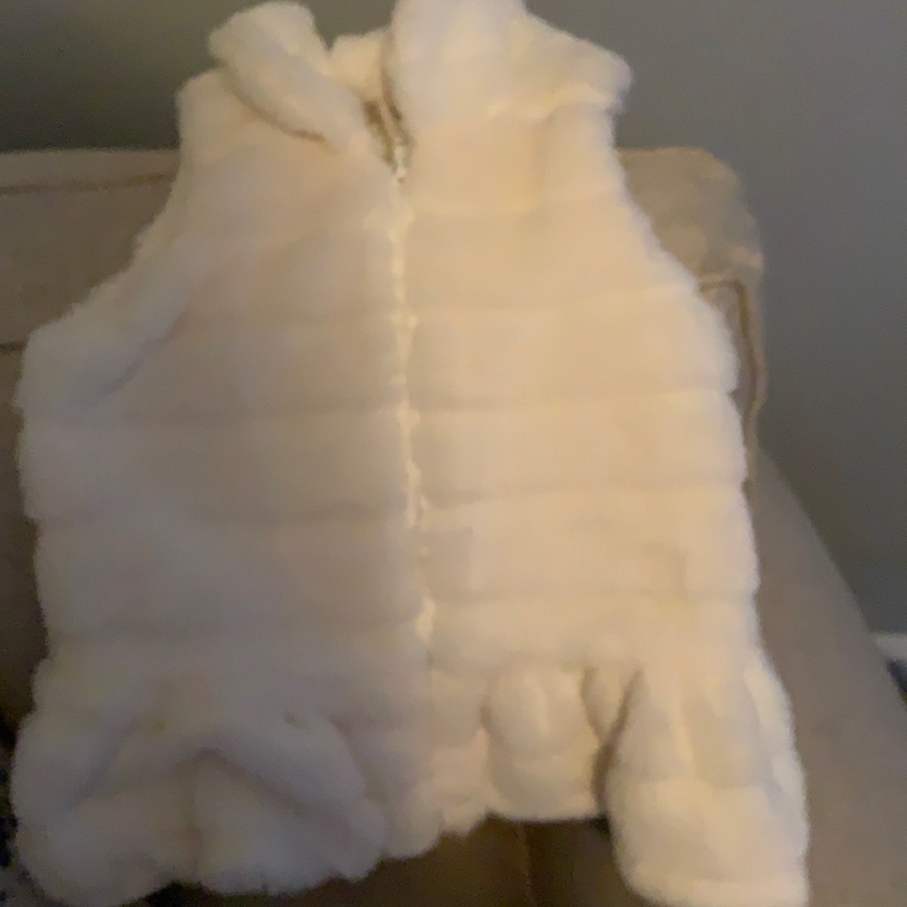 Stylish faux fur vest for the girly girl who loves fashion.